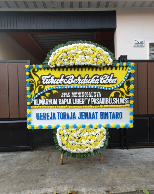 Papan Bunga Duka di Raveni Rara